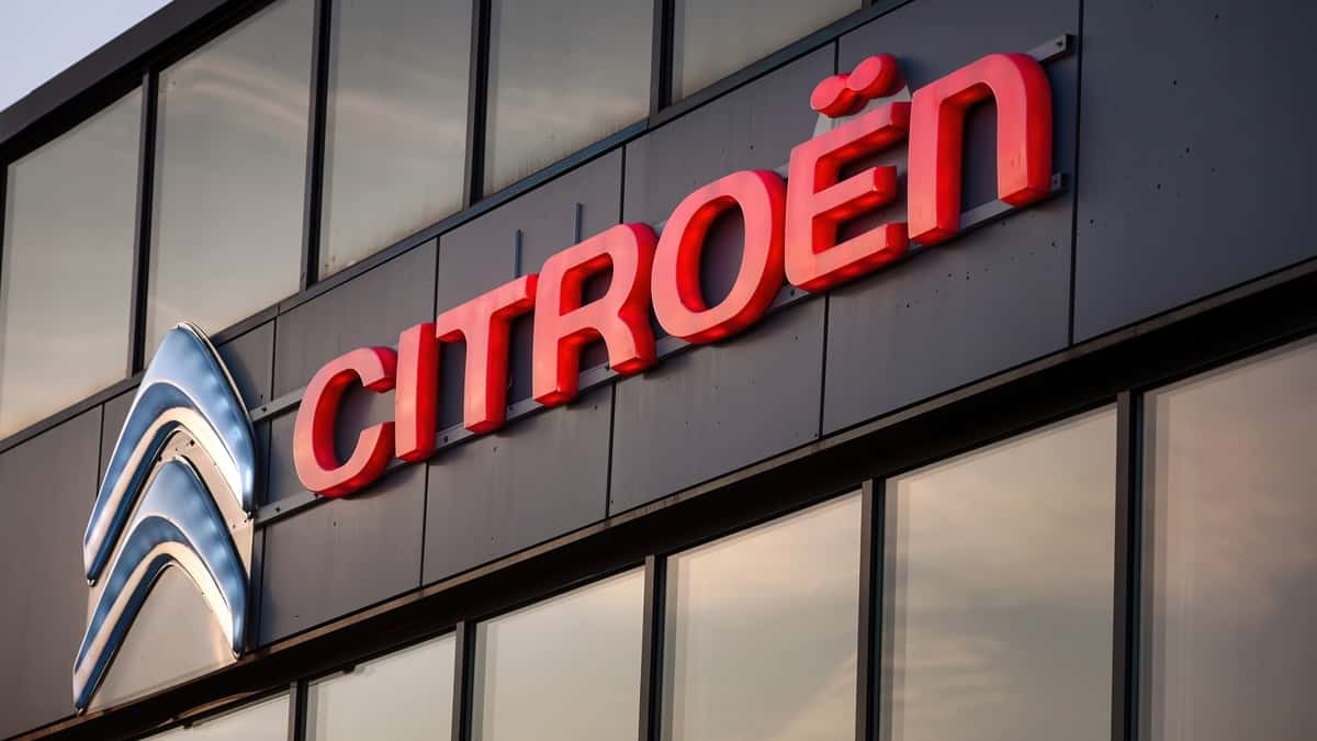 Citroen sign on glass facade of dealership building