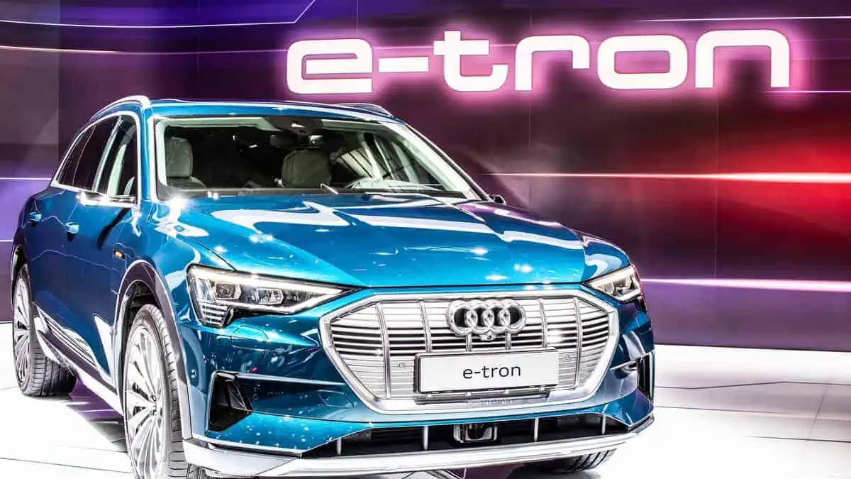 metallic blue electric Audi e-tron 55 quattro SUV with high voltage battery and electric engine motor