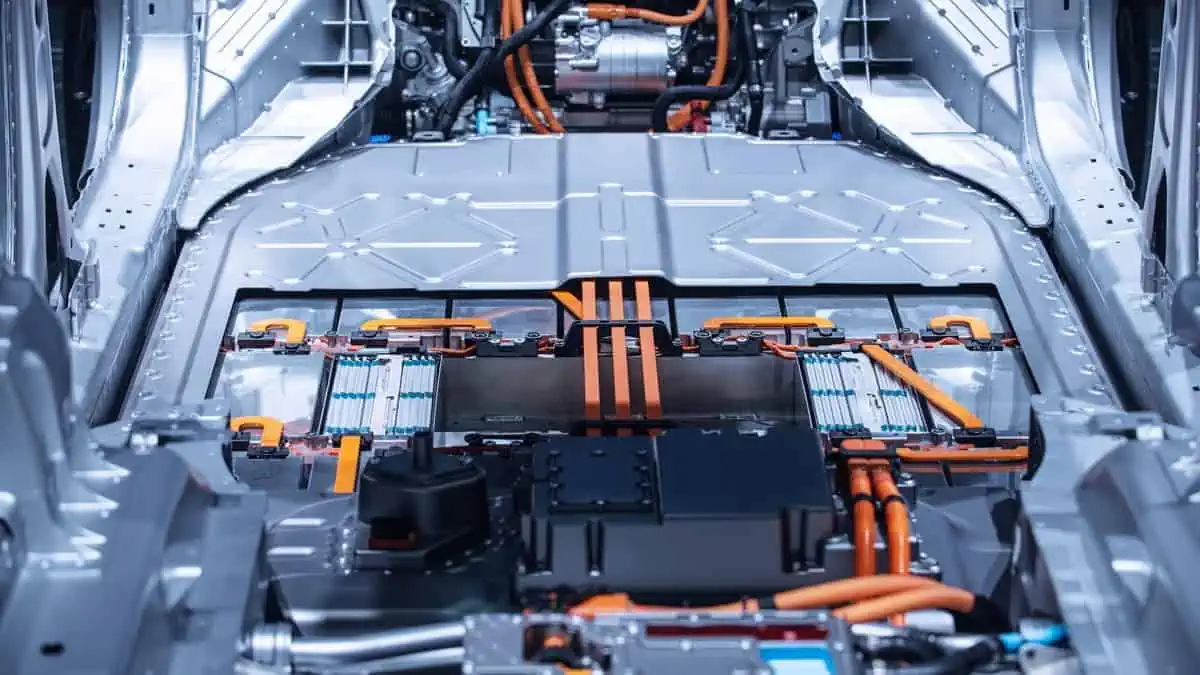 Chassis of the electric car with Battery, powertrain and power connections closeup.