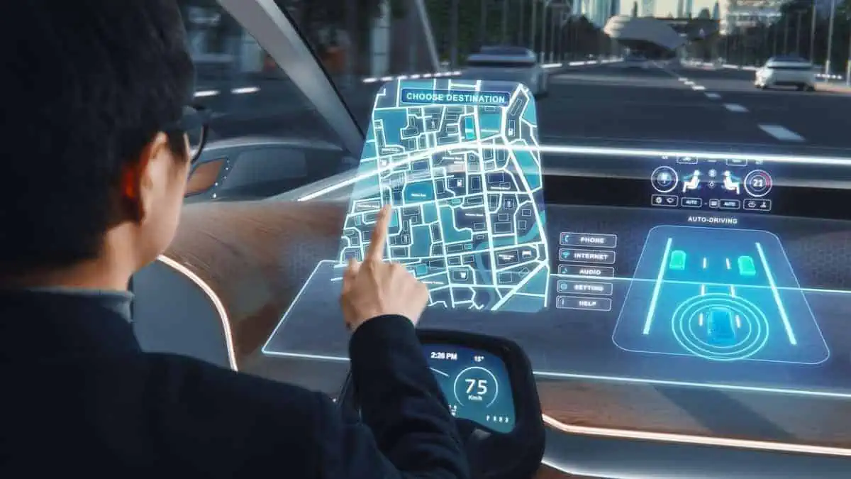 Futuristic Concept Stylish Businessman Setting Location on an Interactive Navigation App on an Augmented Reality Dashboard while Sitting in an Autonomous Self-Driving Zero-Emissions Electric Car.