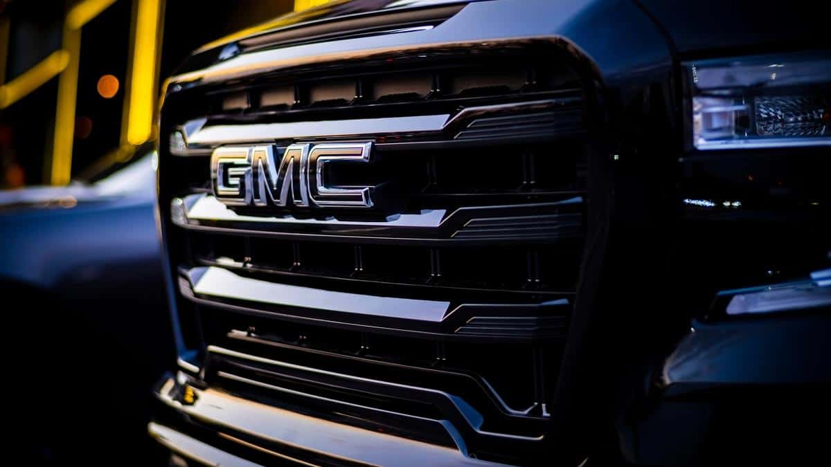 Istanbul, TURKEY - 25 December 2022 Big front grille and logo of GMC Truck (General Motor Company) from GMC Denali Sierra Truck Pickup, blurred background with blue and yellow shades