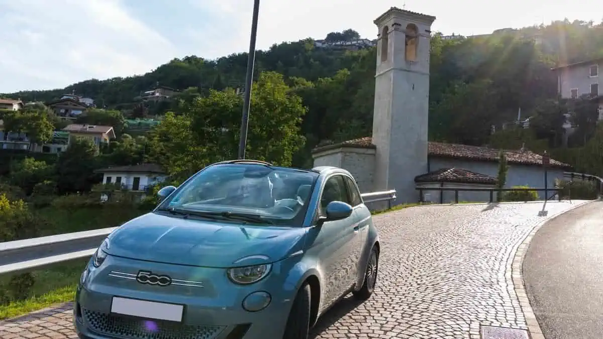 Limone italy 24-08-2021 Fiat 500e Icon Convertible parking in front of the Mount Caplone