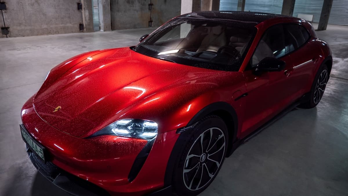 Minsk, Belarus - August 25, 2021 Porsche Taycan Sport Turismo in the underground parking. The car is covered with raindrops. This model is a more practical alternative to the Taycan electric car.